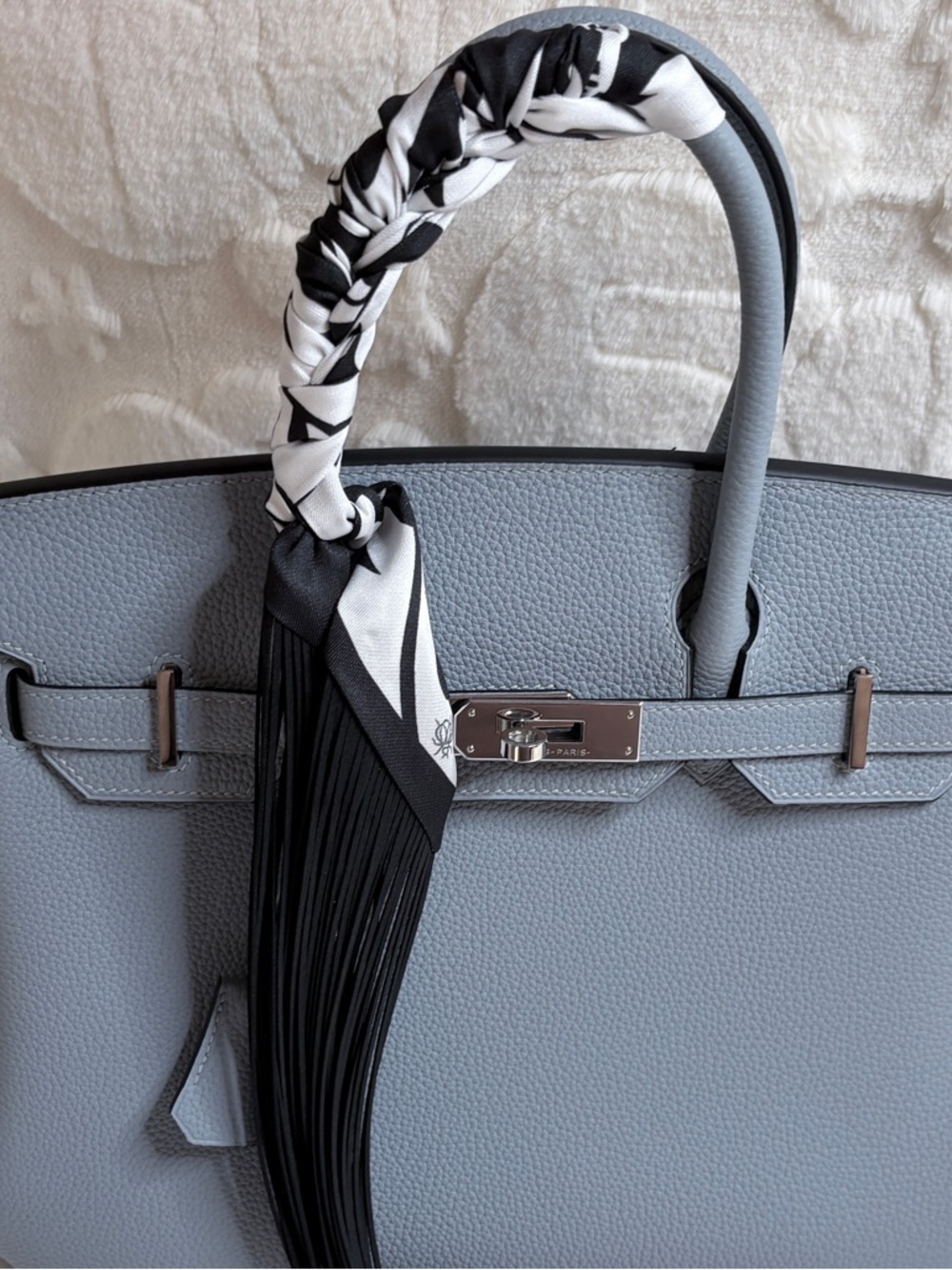 Trendy Fringe Handbag Wrap with black fringe and bold white flower pattern